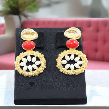 Handmade earrings with bold red oval stone with white petal-like beads