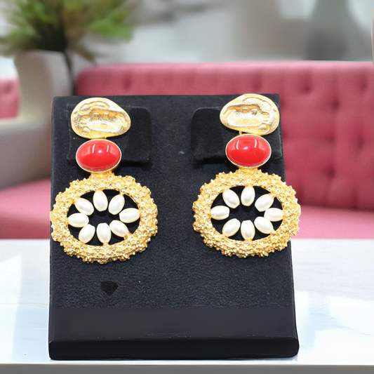 Handmade earrings with bold red oval stone with white petal-like beads