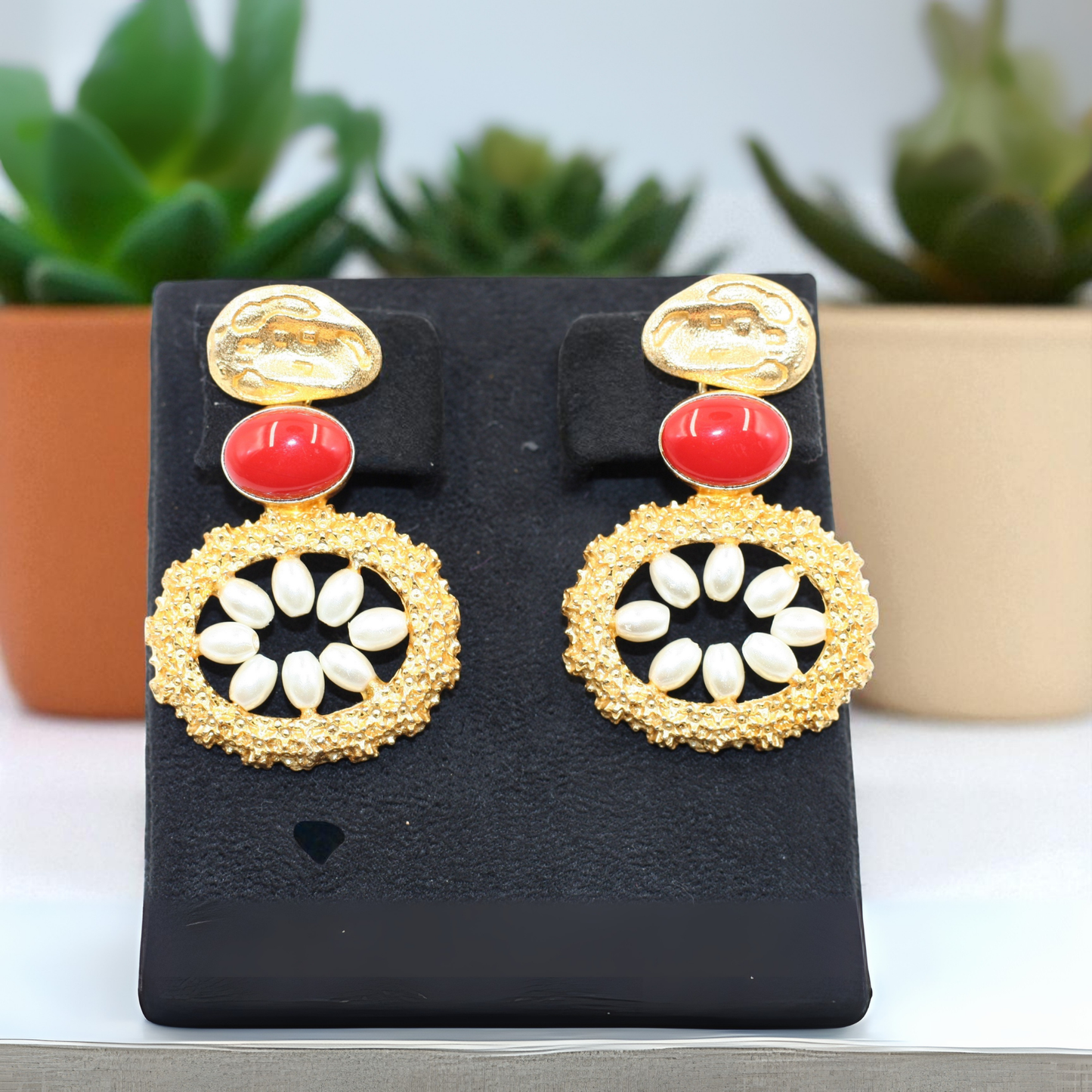 Handmade earrings with bold red oval stone with white petal-like beads