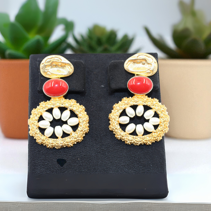 Handmade earrings with bold red oval stone with white petal-like beads