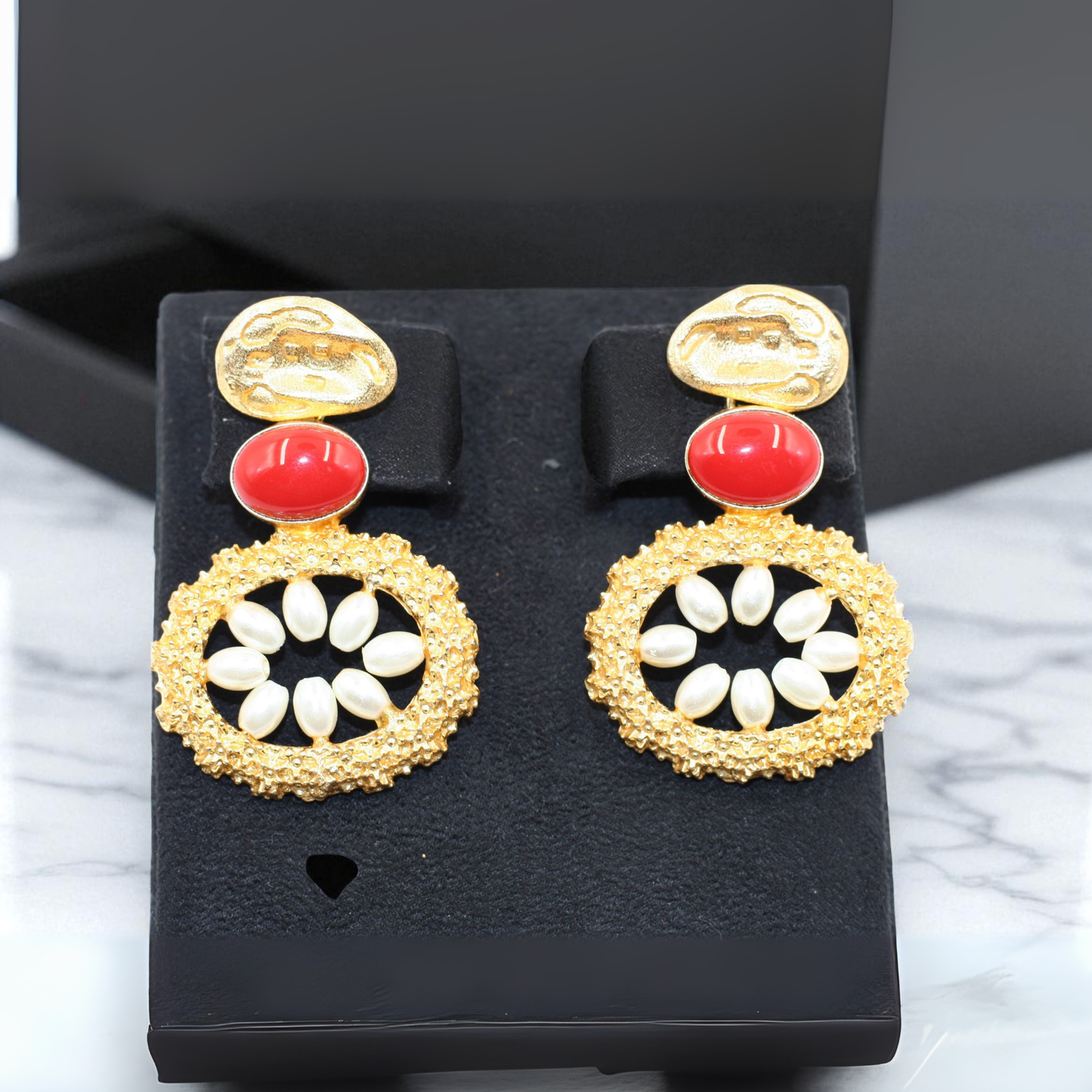 Handmade earrings with bold red oval stone with white petal-like beads