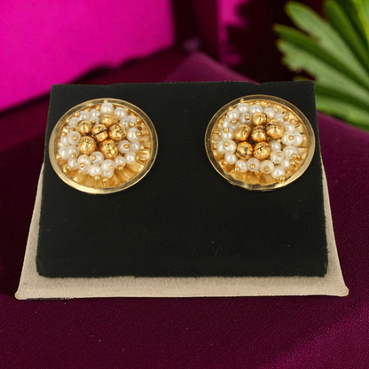 Handmade round earrings with gold-toned beads and dainty white pearls