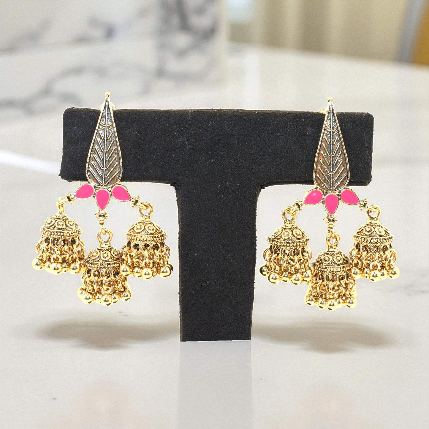 Triple Jhumka Dangler Earrings with Pink Enamel Leaf Design – Antique Gold Finish